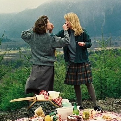 Photo of Laura and Donna feeding each other